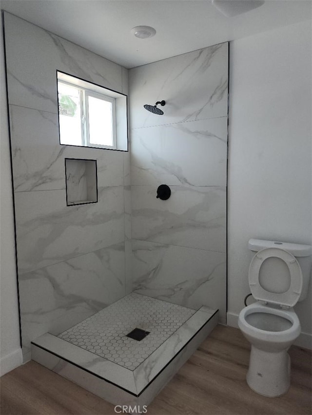 10531 Alexander Ave, South Gate, CA 90280 - bathroom with a marble finish shower and wood finished floors