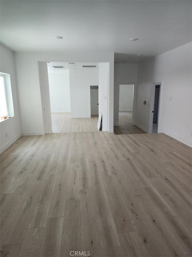 10531 Alexander Ave, South Gate, CA 90280 - unfurnished room with light wood-style flooring and baseboards