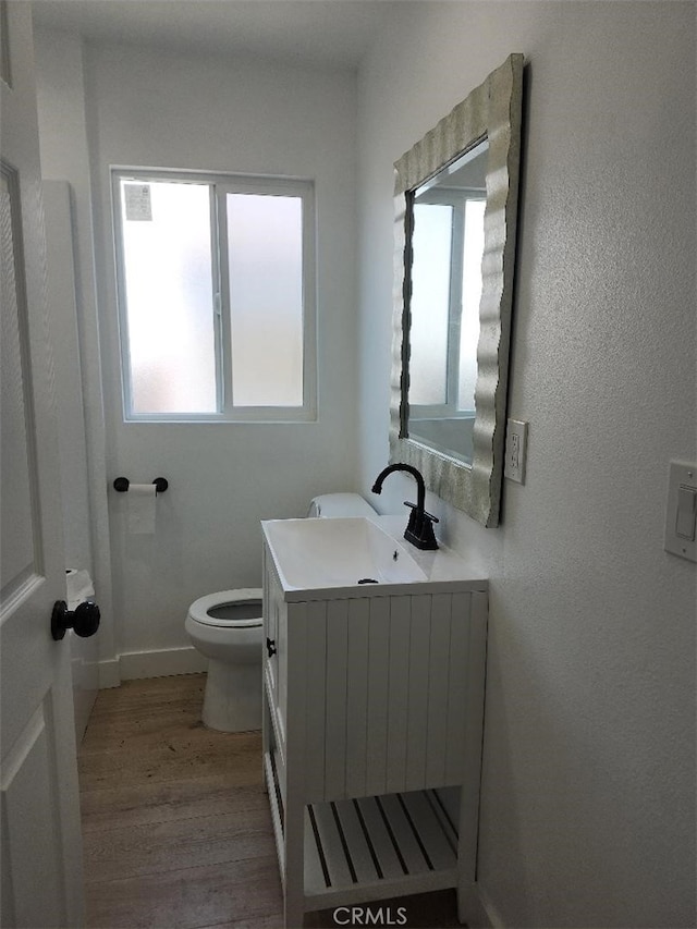 10531 Alexander Ave, South Gate, CA 90280 - bathroom with plenty of natural light, vanity, and wood finished floors