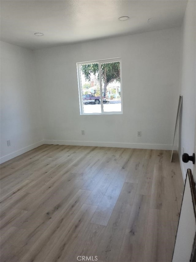 10531 Alexander Ave, South Gate, CA 90280 - empty room with light wood-style floors and baseboards
