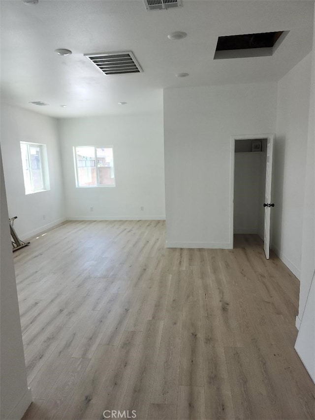 10531 Alexander Ave, South Gate, CA 90280 - unfurnished room with light wood-type flooring and baseboards