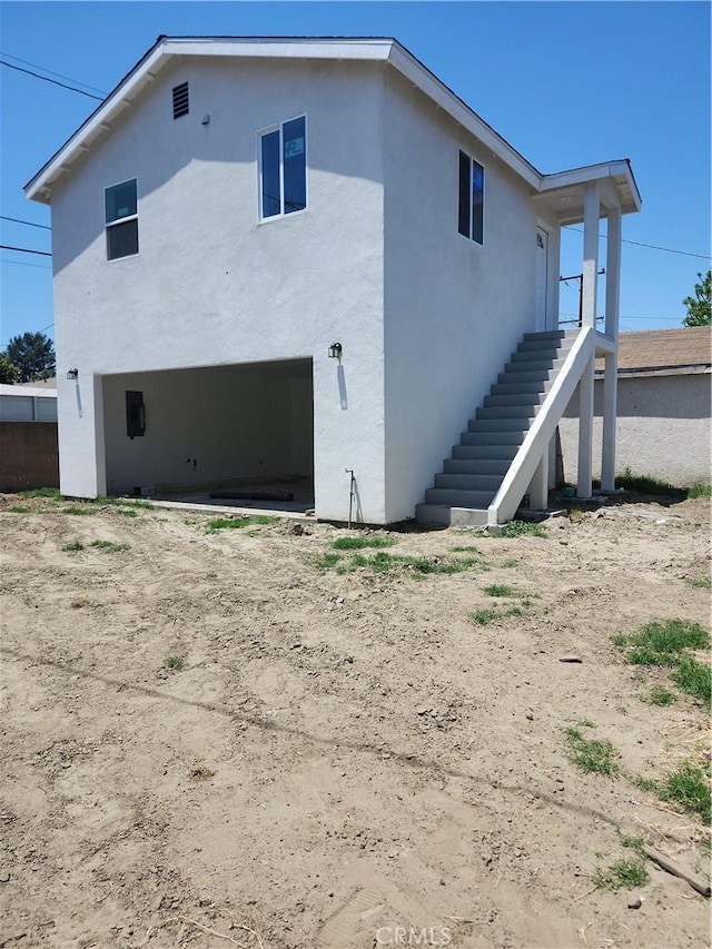 10531 Alexander Ave, South Gate, CA 90280 - rear view of property featuring stucco siding and an attached garage