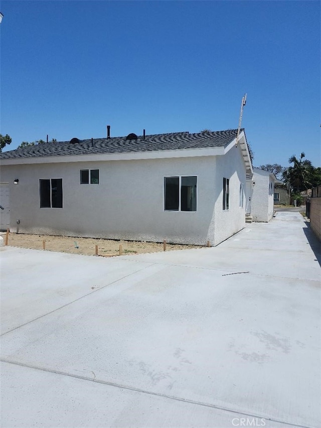10531 Alexander Ave, South Gate, CA 90280 - view of home's exterior featuring stucco siding and concrete driveway