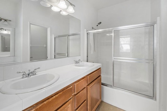 6410 Terraza Portico, Carlsbad, CA 92009 - bathroom featuring double vanity and bath / shower combo with glass door