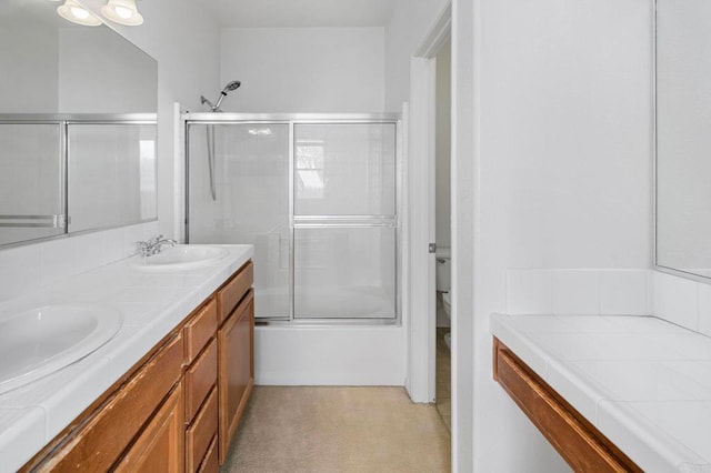 6410 Terraza Portico, Carlsbad, CA 92009 - full bath featuring double vanity and combined bath / shower with glass door
