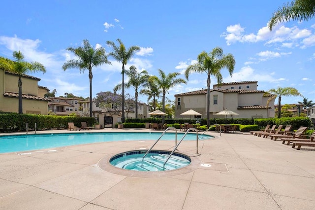6410 Terraza Portico, Carlsbad, CA 92009 - community pool featuring a hot tub, a patio, and a residential view
