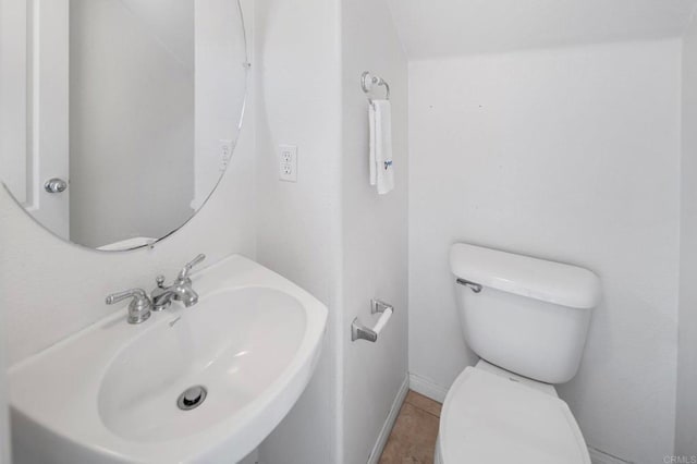 6410 Terraza Portico, Carlsbad, CA 92009 - half bathroom with a sink and tile patterned floors