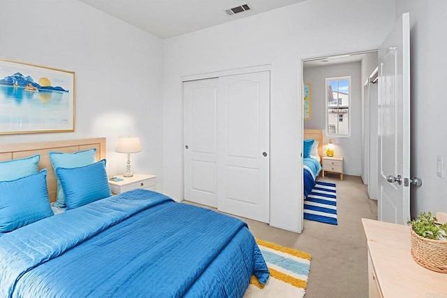 6410 Terraza Portico, Carlsbad, CA 92009 - bedroom featuring light colored carpet and a closet