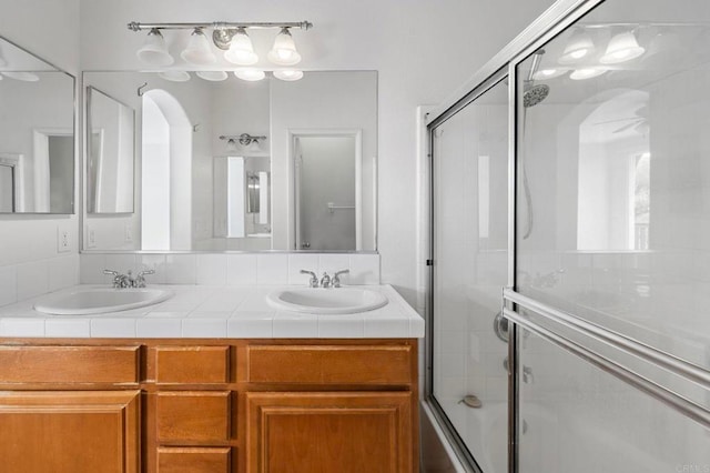 6410 Terraza Portico, Carlsbad, CA 92009 - bathroom with enclosed tub / shower combo and double vanity