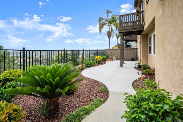 6410 Terraza Portico, Carlsbad, CA 92009 - fenced backyard with a patio and a balcony