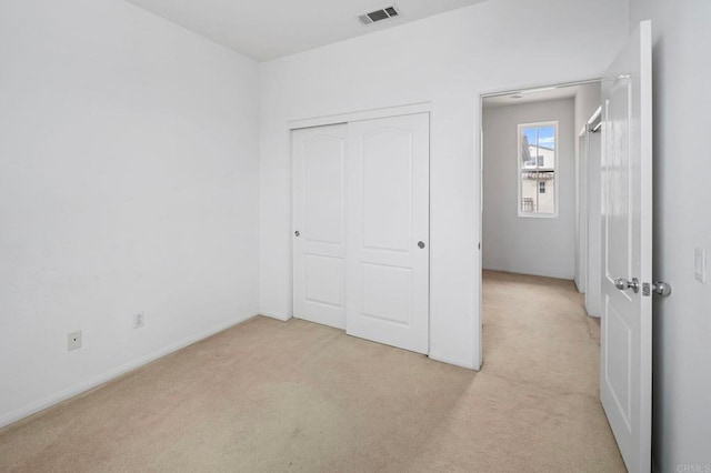6410 Terraza Portico, Carlsbad, CA 92009 - unfurnished bedroom with light colored carpet and a closet