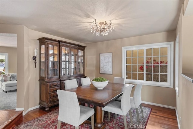 5620 La Paz St, Long Beach, CA 90803 - dining room featuring wood finished floors and a chandelier