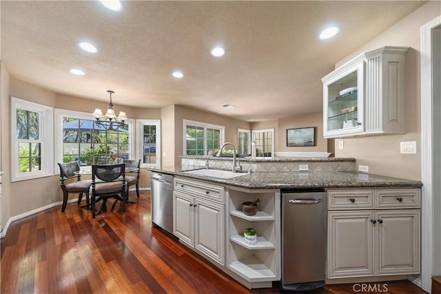 5620 La Paz St, Long Beach, CA 90803 - kitchen featuring recessed lighting, dark wood-type flooring, a chandelier, stainless steel dishwasher, and stone countertops