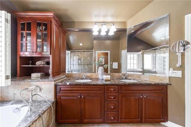 5620 La Paz St, Long Beach, CA 90803 - bathroom featuring a tile shower, double vanity, a garden tub, and vaulted ceiling