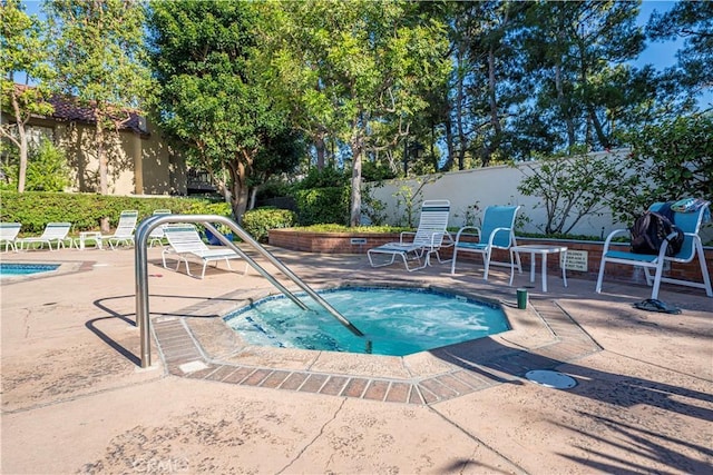 5620 La Paz St, Long Beach, CA 90803 - view of swimming pool with a hot tub and a patio