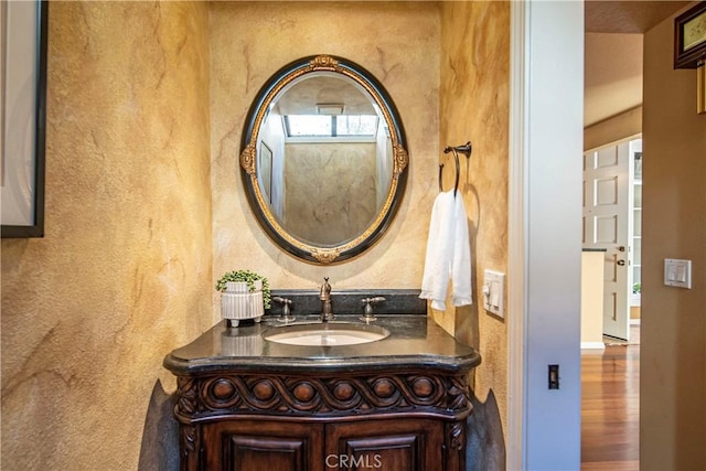 5620 La Paz St, Long Beach, CA 90803 - bathroom with vanity, wood finished floors, and a textured wall