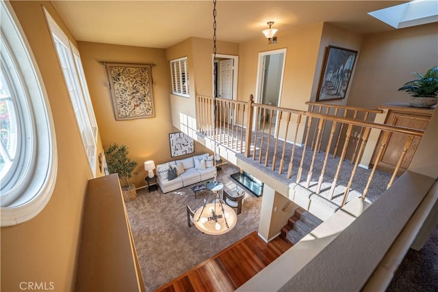 5620 La Paz St, Long Beach, CA 90803 - living room featuring a skylight and wood finished floors