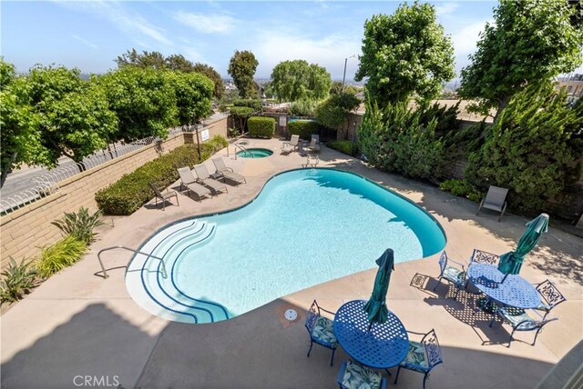 2700 E Panorama Dr Unit 208, Signal Hill, CA 90755 - community pool featuring a fenced backyard, a patio, and a community hot tub