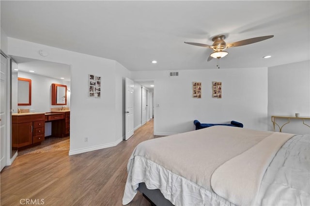 2700 E Panorama Dr Unit 208, Signal Hill, CA 90755 - bedroom featuring light wood-style flooring, recessed lighting, ensuite bath, ceiling fan, and a desk