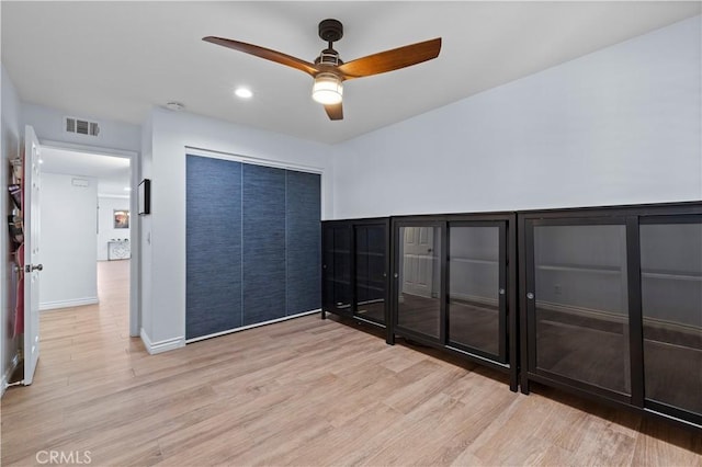 2700 E Panorama Dr Unit 208, Signal Hill, CA 90755 - unfurnished bedroom featuring wood finished floors, a closet, ceiling fan, and recessed lighting