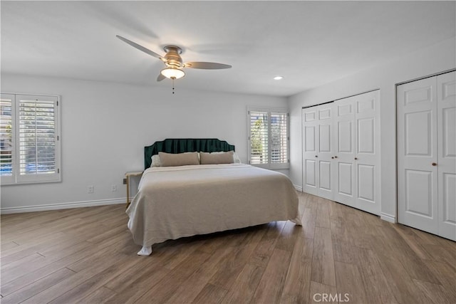 2700 E Panorama Dr Unit 208, Signal Hill, CA 90755 - bedroom with wood finished floors, multiple closets, a ceiling fan, and recessed lighting