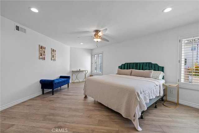 2700 E Panorama Dr Unit 208, Signal Hill, CA 90755 - bedroom featuring multiple windows, recessed lighting, wood finished floors, and a ceiling fan