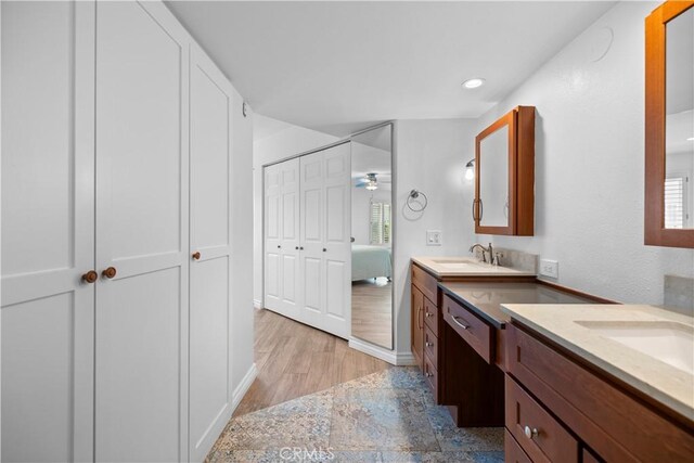 2700 E Panorama Dr Unit 208, Signal Hill, CA 90755 - ensuite bathroom with two vanities, ceiling fan, and recessed lighting