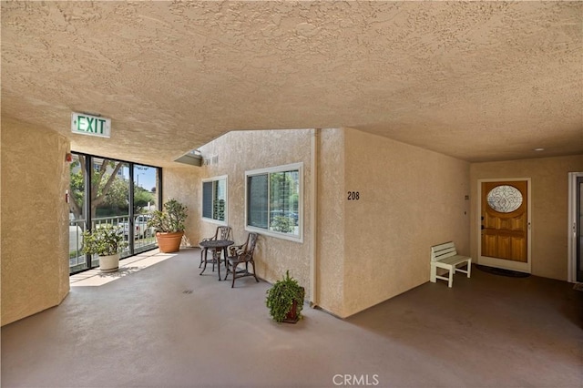 2700 E Panorama Dr Unit 208, Signal Hill, CA 90755 - doorway to property with stucco siding and a patio area