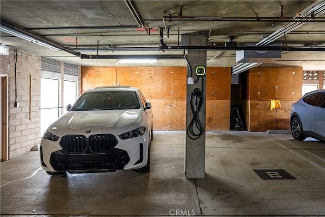 2700 E Panorama Dr Unit 208, Signal Hill, CA 90755 - parking deck featuring a garage door opener
