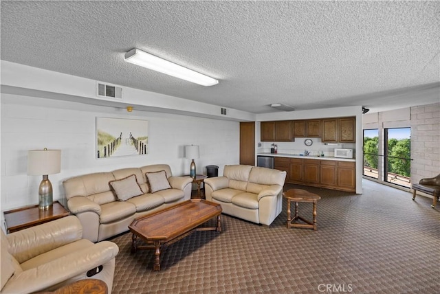 2700 E Panorama Dr Unit 208, Signal Hill, CA 90755 - living area featuring a textured ceiling