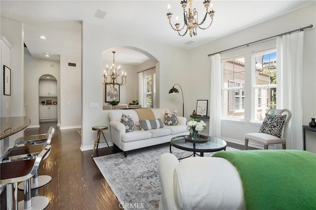 6 Via Amanti, Newport Coast, CA 92657 - living area with a chandelier, arched walkways, healthy amount of natural light, dark wood finished floors, and recessed lighting