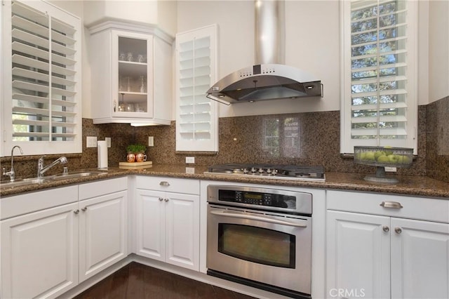 6 Via Amanti, Newport Coast, CA 92657 - kitchen with stainless steel appliances, ventilation hood, glass insert cabinets, and white cabinetry
