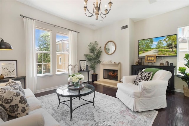 6 Via Amanti, Newport Coast, CA 92657 - living area with a chandelier, a warm lit fireplace, and wood finished floors