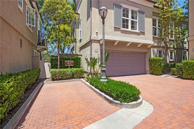 6 Via Amanti, Newport Coast, CA 92657 - exterior space with an attached garage, stucco siding, and decorative driveway
