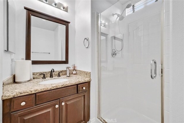 7059 E Monaco, Orange, CA 92867 - bathroom featuring a shower stall and vanity