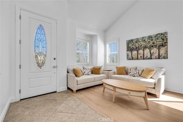 7059 E Monaco, Orange, CA 92867 - entrance foyer featuring high vaulted ceiling and light wood-style floors