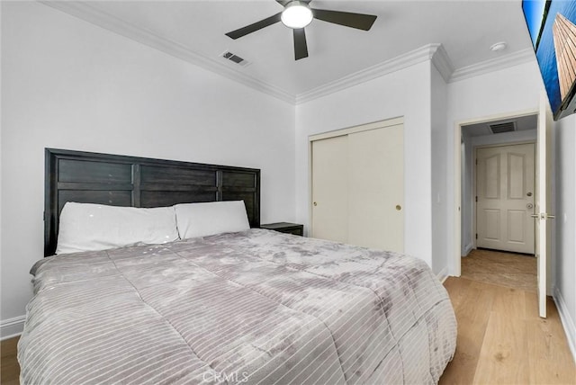 7059 E Monaco, Orange, CA 92867 - bedroom featuring ornamental molding, wood finished floors, a closet, and ceiling fan
