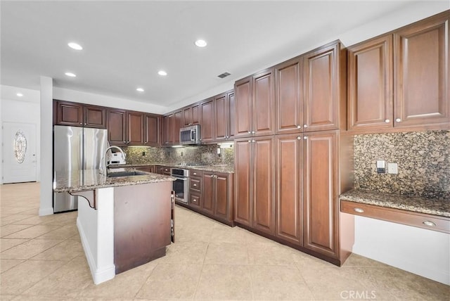 7059 E Monaco, Orange, CA 92867 - kitchen with appliances with stainless steel finishes, light tile patterned floors, tasteful backsplash, light stone countertops, and recessed lighting