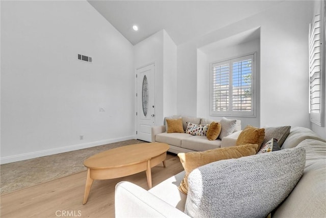 7059 E Monaco, Orange, CA 92867 - living room featuring high vaulted ceiling and light wood-type flooring