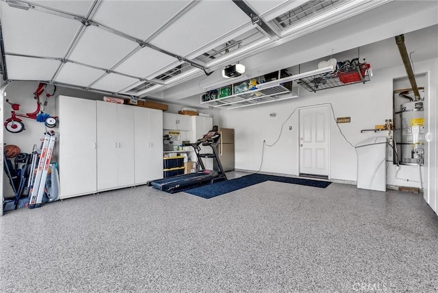 7059 E Monaco, Orange, CA 92867 - garage featuring strapped water heater and freestanding refrigerator