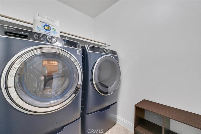7059 E Monaco, Orange, CA 92867 - laundry area featuring washing machine and clothes dryer and baseboards
