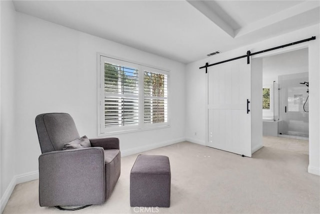 7059 E Monaco, Orange, CA 92867 - living area with a barn door, healthy amount of natural light, and carpet flooring