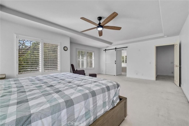 7059 E Monaco, Orange, CA 92867 - bedroom with a tray ceiling, carpet, a barn door, and ceiling fan
