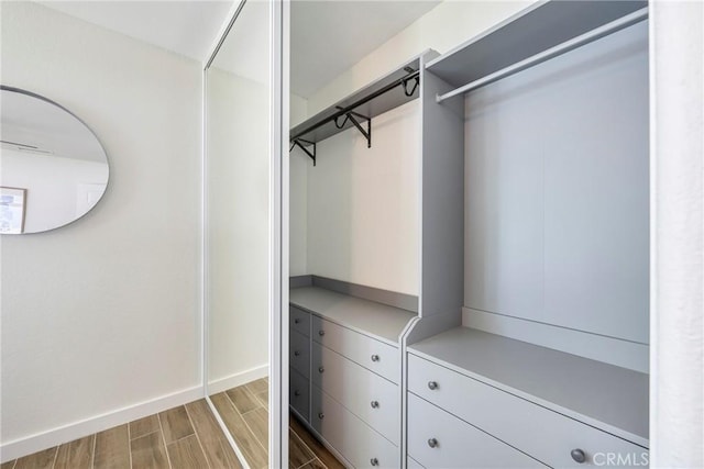 2302 Cayuga Ave, Placentia, CA 92870 - walk in closet featuring wood finished floors
