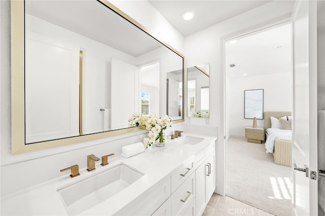 56 Cartwheel, Irvine, CA 92618 - ensuite bathroom featuring double vanity, tile patterned flooring, and recessed lighting