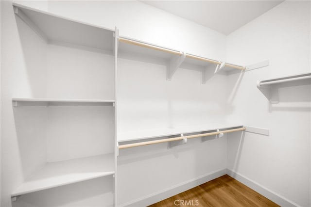 56 Cartwheel, Irvine, CA 92618 - spacious closet featuring wood finished floors