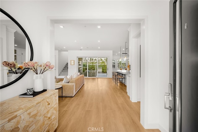 56 Cartwheel, Irvine, CA 92618 - hall with stairs, light wood finished floors, and recessed lighting