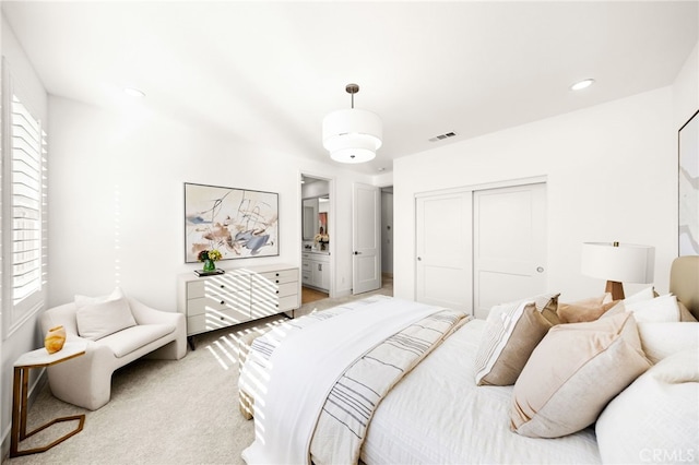 56 Cartwheel, Irvine, CA 92618 - bedroom featuring a closet, light carpet, and connected bathroom