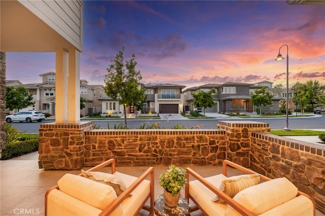 56 Cartwheel, Irvine, CA 92618 - patio terrace at dusk featuring a residential view