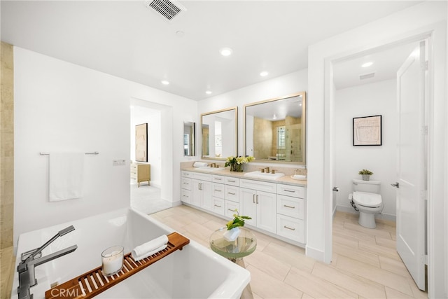 56 Cartwheel, Irvine, CA 92618 - bathroom with a soaking tub, double vanity, recessed lighting, and tile patterned floors